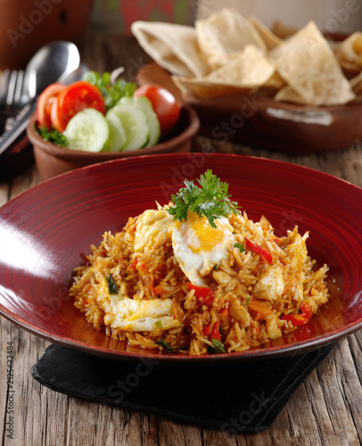Delicious Indonesian Nasi Goreng Fried Rice with Egg and Salad.