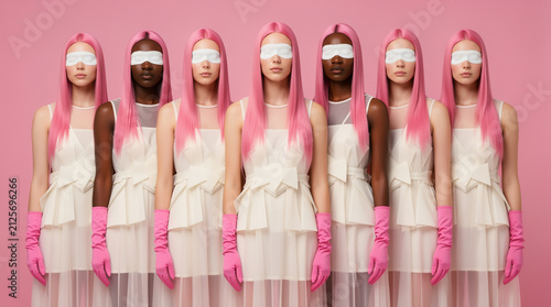 Contemporary Fashion Editorial: Diverse Models with Sleek Pink Hair and White Eye Bands in Minimalist Pink Space
