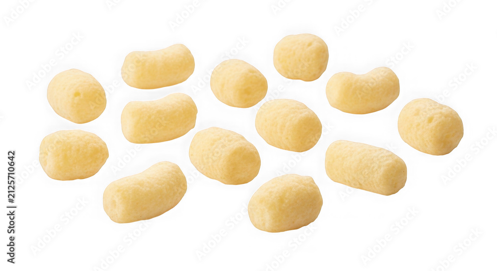 Fototapeta premium Golden vitamin capsules scattered on white background. Dietary supplement pills for health and wellness isolated cutout.