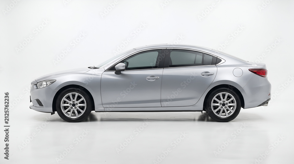 Naklejka premium Modern White Sedan Car Isolated Side View in Studio Setup with White Background