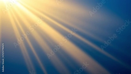 Bright golden sun rays shining through blue sky background, ethereal heavenly light beam concept for spiritual awakening and divine hope inspiration