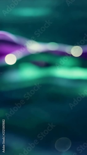 A Captivating Dance of Waves: A Visual Journey Through Hypnotic Fluid Dynamics Featuring Rich Purple and Iridescent Tones Blending Harmoniously Together.