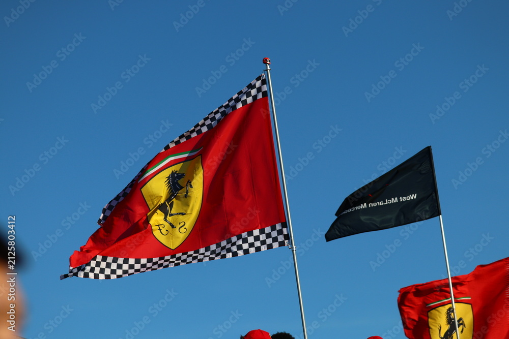 Obraz premium 22 May 2026, Montreal, Canada: Ferrari flags wave above Formula 1 fans at Grand Prix weekend. g.