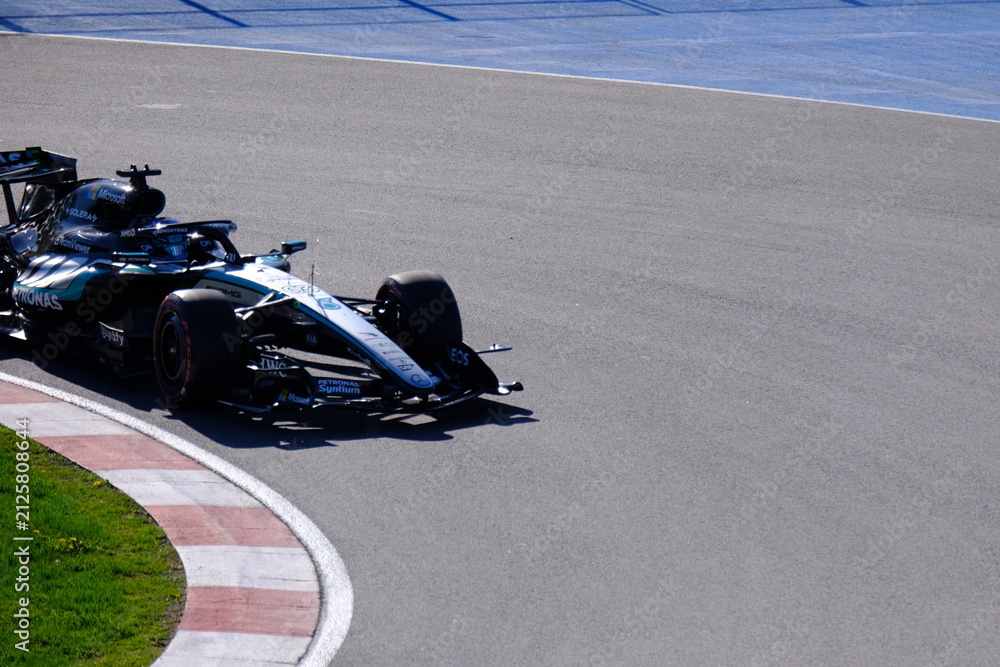 Obraz premium May 24, 2026, Montreal, Canada, Mercedes F1 car racing through Circuit Gilles Villeneuve corner. g.