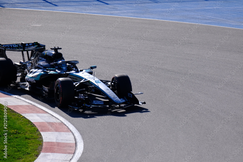 Obraz premium May 24, 2026, Montreal, Canada, Mercedes F1 car racing through Circuit Gilles Villeneuve corner. g.