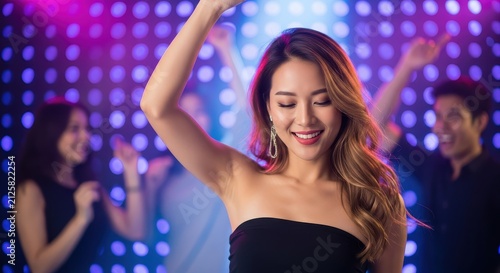 Beautiful Asian Woman Dancing and Having Fun at a Nightclub Party with Friends and Colorful Bokeh Lights Background