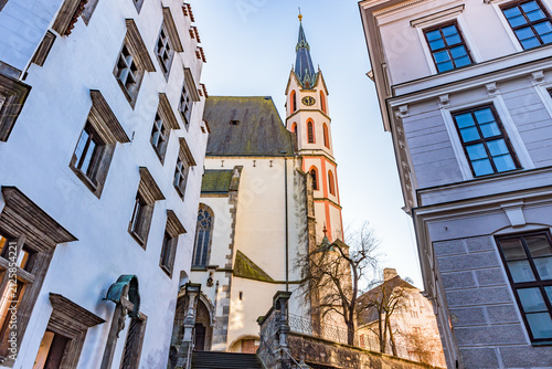 Gothic Church of St. Vitus framed by historic buildings in old town of Cesky Krumlov, Czechia, UNESCO World Heritage Site