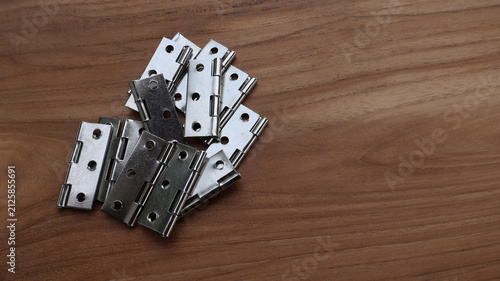 Steel Butt Hinges on Wooden Surface with Copy Space