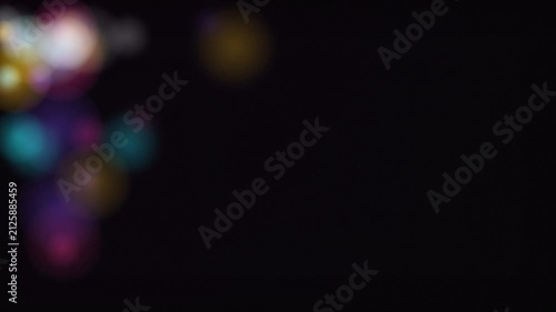 Abstract Bokeh Lights Swirling on Dark Background