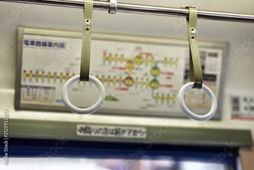 Train interior grab handles and route map for professional travel concept background in Japan.