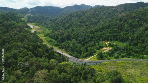 Drone Orbit shot of Mountain Road Through Primary Rainforest between Kuala Tahan and Kuala Sat, Pahang, Malaysia