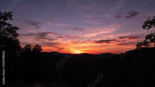 Dramatic Sunset Over Rolling Hills Fiery Sky Time Lapse