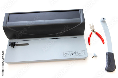 Obraz na płótnie Manual spiral binding machine with handle and pliers on white