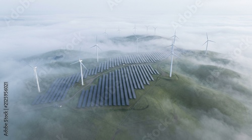 Renewable energy farm with solar panels and wind turbines in foggy landscape with aerial view renewable featuring rows solar foggy green hillside energy production clean energy