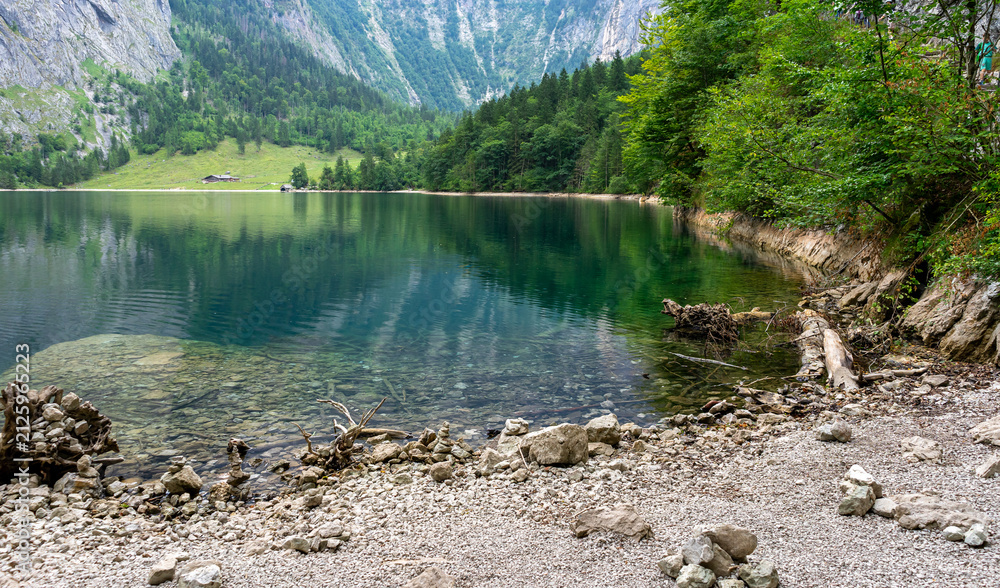 Obraz premium Scenic View of an Alpine Pasture with a Mountain Lake in the Berchtesgaden Alps, Bavaria, Germany