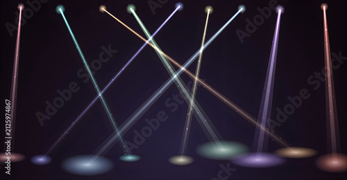 Colorful stage spotlights beams shining on a dark background