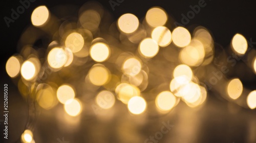 Abstract Golden Bokeh Lights Background for Festive Concept