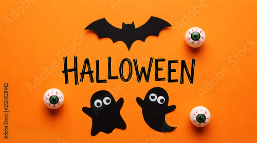 Halloween text with black cat, bat, and jack-o'-lantern