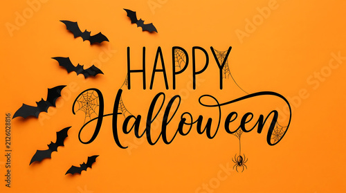Halloween text with orange background, and black bats