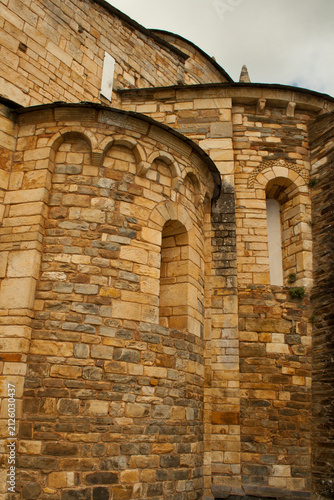 Historic Stone Wall with Arches - Ancient Romanesque Architecture Detail. San Martiño Church
