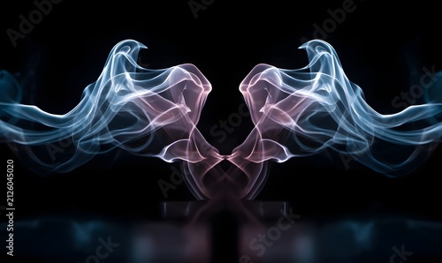 Symmetrical white and pink smoke swirls with purple and blue highlights against a black background.