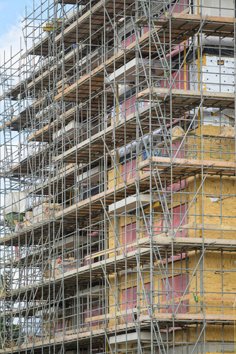 Scaffolding covering an apartment building under construction