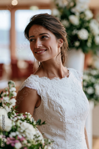 Idyllic elegant bride portrait beside floral arrangements, sophisticated marriage ceremony gown, bright warm season daylight, romantic atmosphere,