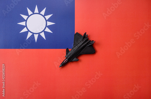 Konstfotografi A fighter jet against the taiwanese flag as a conceptual background representing