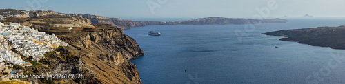 Fotografie Panoramic view of Santorini volcanic caldera with white Fira houses on steep cli