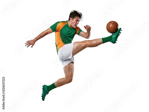 Male soccer player kicking ball