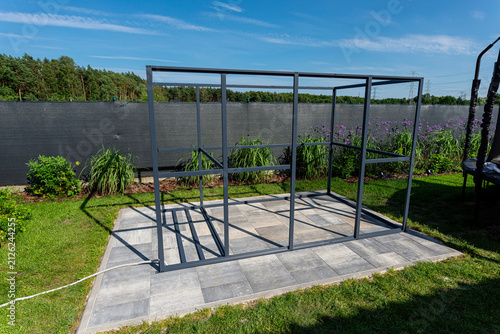 Metal frame structure for garden woodshed construction