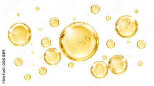 Golden oil drops isolated on white. Transparent cosmetic serum bubbles for skincare design.