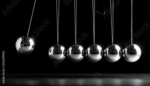 Newton's Cradle Pendulum Balls in Motion Demonstrating Physics Principles and Energy Transfer