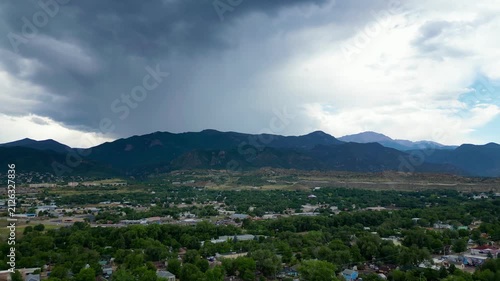 Aerial drone flyover of cloudy, rainy mountain region