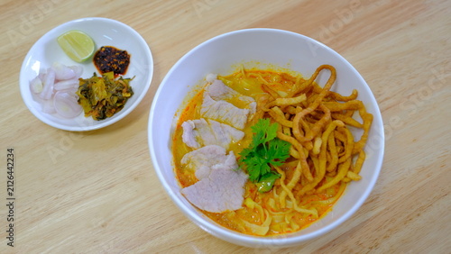 Photography Noodle with meat pork meatball chicken curry soup , Thai called khao soi kai ,No