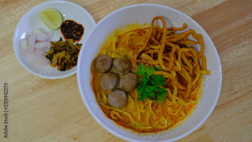 Photography Noodle with meat pork meatball chicken curry soup , Thai called khao soi kai ,No