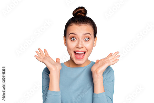 Close up photo cute charming lady astonished impressed incredible news gift present desire dream surprise shout scream open mouth raise hand palm dressed modern cotton outfit isolated blue background