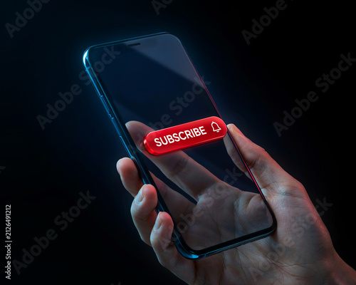 Hand holding smartphone with subscribe button. Digital social media engagement concept.