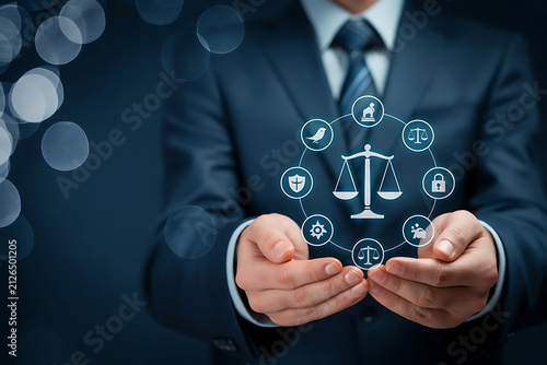 Businessman holding scales of justice surrounded by legal icons representing law and order concept in professional setting