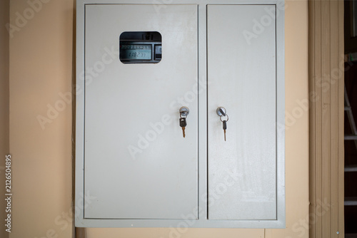 Close-up of an electrical box with two keys inserted.