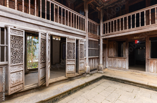 Traditional Vietnamese wooden house courtyard in Dinh thu Vua Meo, Ha Giang, Vietnam