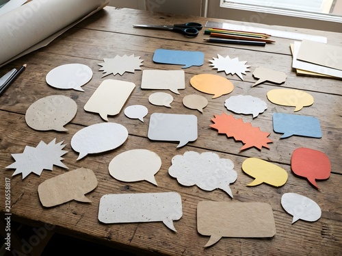 Blank Paper Cut Speech Bubbles Collection on Wooden Table