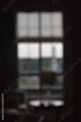 Принти на полотні A dreamy view of a window in the dark.