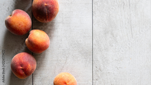 Fresh peach presentation background on white wood