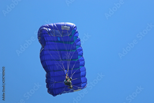Skydiver in a blue sky	