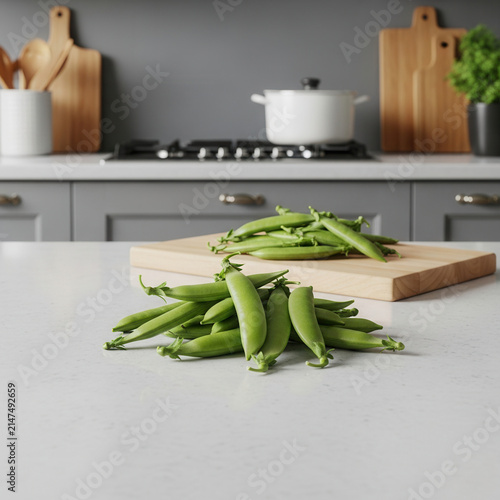Fresh Green Peas On A Light Countertop With A Blurred Kitchen Background