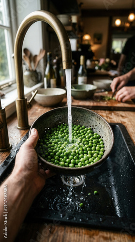 Fresh Green Peas Rinsed Under Running Water Preparing for Culinary Delights