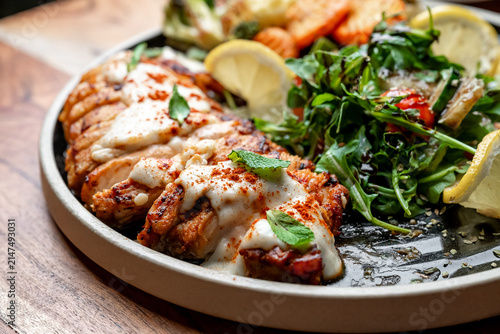 Konstfotografi Sliced grilled chicken breast with side salad