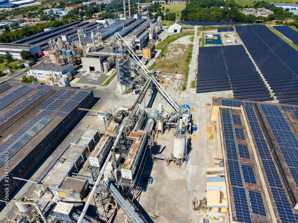 Obraz premium Factory area with solar panels and machinery located in industrial zone in daylight