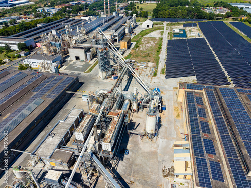 Factory area with solar panels and machinery located in industrial zone in daylight